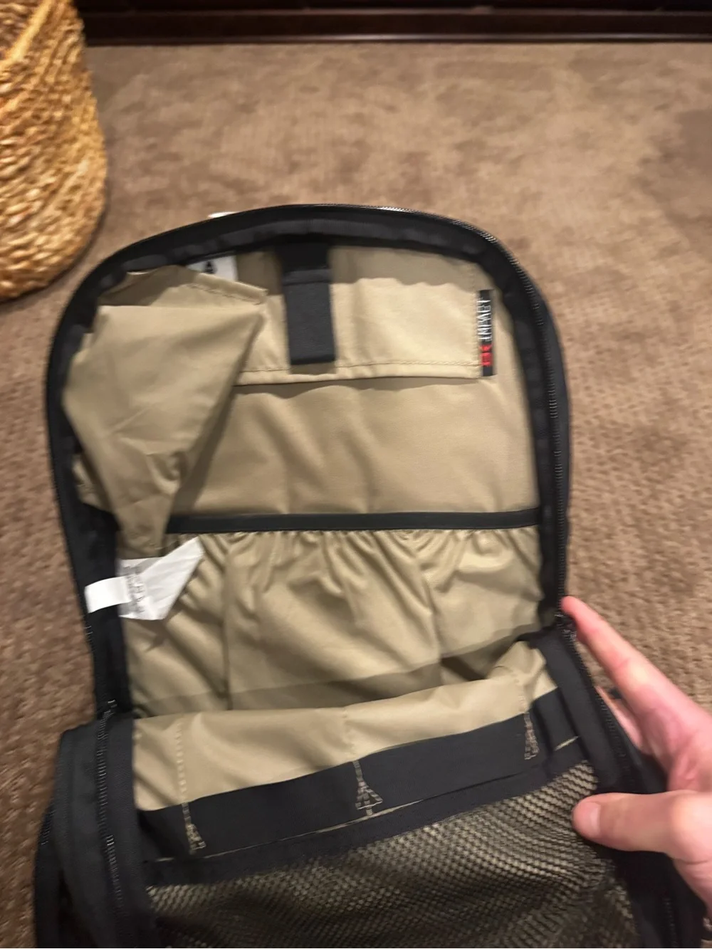 Dakine Black hydration Backpack with Tan Patterned Straps and hip straps